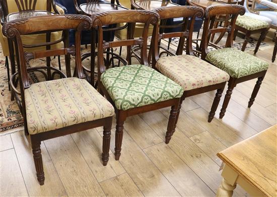 A set of six George IV carved mahogany dining chairs on turned reeded legs